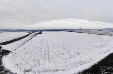 Aerial winter landscape from a snowy field in Hungary