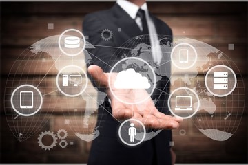 Man holding business elements icons on screen