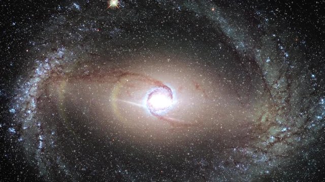 Spiral galaxy rotating in outer space with star field and flare light. Contains public domain image by Nasa