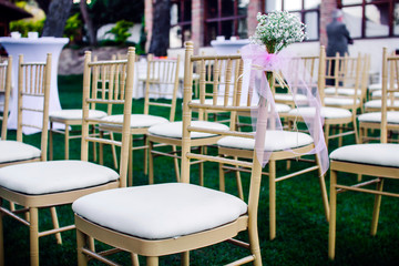 flowers in chairs wedding decoration