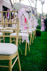flowers in chairs wedding decoration