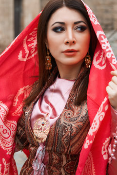 Beautiful middle eastern women wearing traditional dress, posing outdoors
