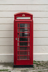 	Classic telephone box located in dover with a white background