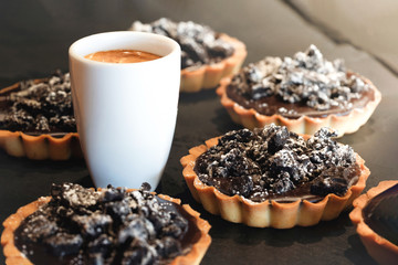 Coffe cup wits delicious chocolate tarts