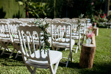 flowers in chairs wedding decoration