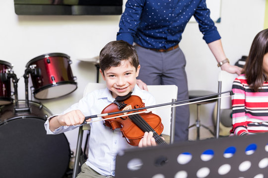 Student Developing His Hobby Of Playing Violin