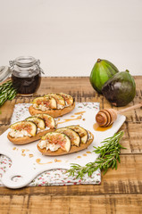 Swedish toasts with figs, cheese, rosemary, honey and walnuts