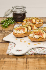 Swedish toasts with figs, cheese, rosemary, honey and walnuts