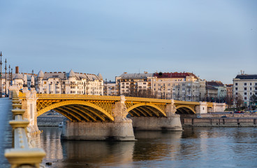 Naklejka premium View of the Margaret Bridge over the Danube lit by the rays of the setting sun. In Budapest, Hungary