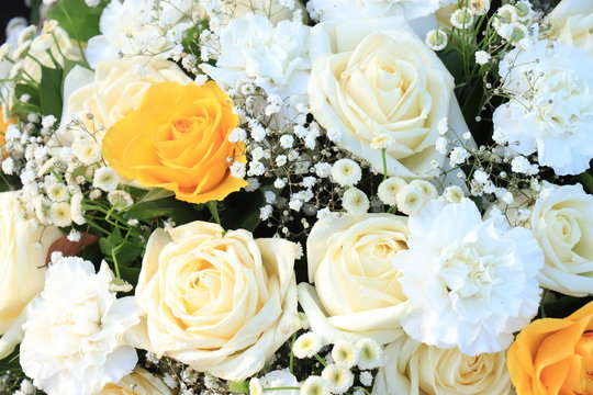 White and yellow wedding arrangement