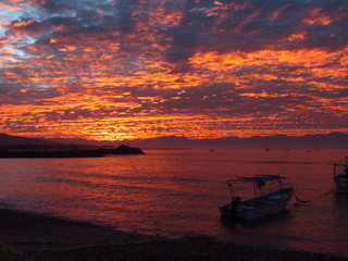 sunrise by the ocean with a sea of clouds