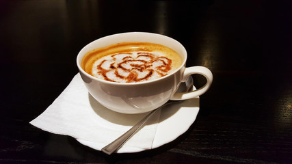 The cup of latte or cappuccino coffee with milk.