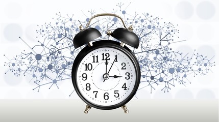 Retro alarm clock on blurred background