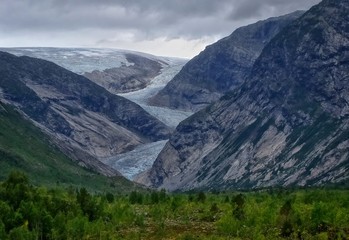 Naklejka na ściany i meble view from far away of a glacier Nigardsbreen, Norway, Europe, august 2018