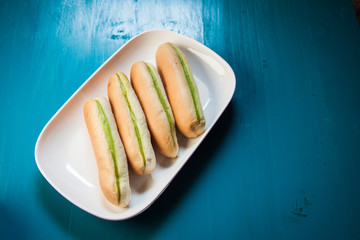 Green Custard bread Green cream cooking by banana leaf, Bread in breafast on the blue paint color...