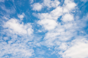 White clouds with blue sky background in sunny day. Green environmental and natural travel concept.