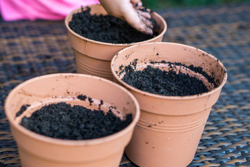 Little girl is planting in a garden