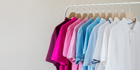 Men shirts hanging in row on rack