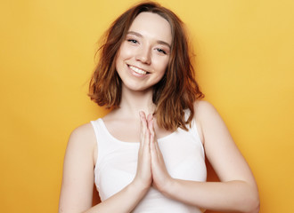 Portrait of young  positive female with cheerful expression