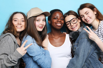   Cheerful European, Asian and African womens.