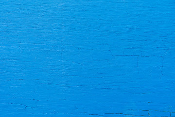 Old blue paint on wood texture abstract background.