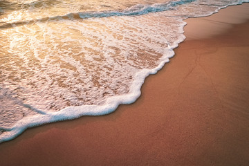 Sunset beach and smooth wave abstract texture background.