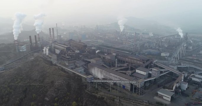 Aerial view of big factory in China.Air pollution by smoke coming out of chimneys. Coal Fossil Fuel Power Plant Smokestacks Emit Carbon Dioxide Pollution. Chengde, China