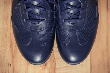 Elegant stylish navy blue shoes for men on board