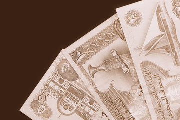 UAE dirham currency background close up. Brown color toned