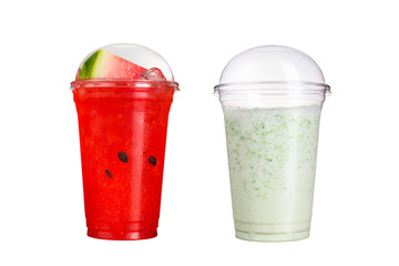 Delicious fruit smoothies in plastic cups, on a white background. Two cocktails with the taste of watermelon and milk.