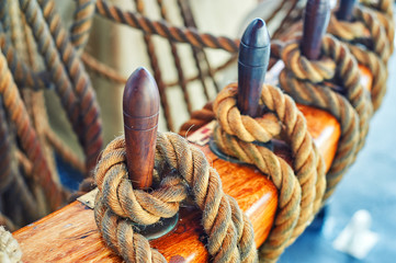 Close-up of mooring rope tied around the bollard by boat or ship