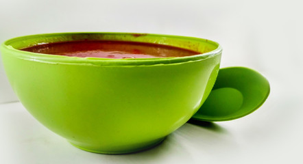 Tomato soup in a bowl isolated on white background