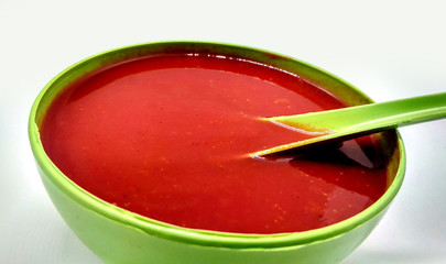 Tomato soup in a bowl isolated on white background