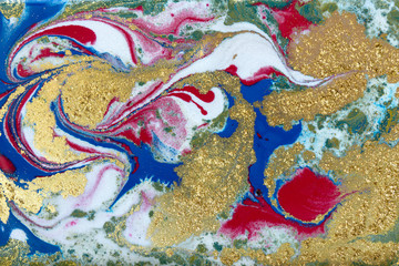 Blue, red and gold marbling pattern. Golden marble liquid texture.