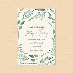 save the date card with green metallic foliage frame