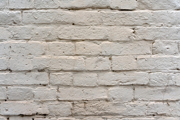 Brick wall painted with white paint as background and texture