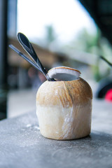 Close Up of Coconut water with blurred background and copyspace.
