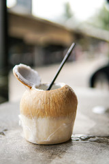 Close Up of Coconut water with blurred background and copyspace.