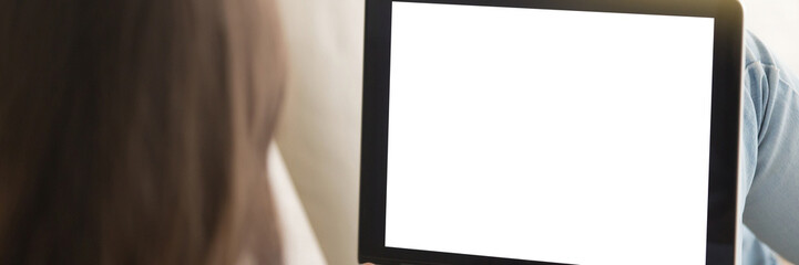 Panoramic back view woman using computer with mockup blank screen