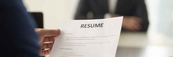 Boss holding resume cv paper interviewing vacancy candidature panoramic image