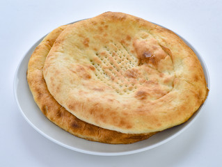 a traditional pakistani fluffy and oily bread baked in clay oven