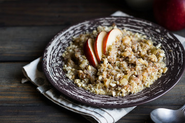 Buckwheat porridge with milk, apple, raisins and cashew nuts