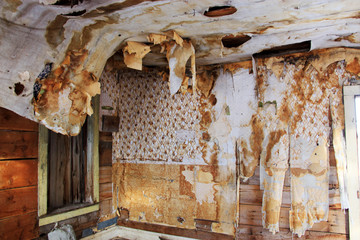 Torn and stained wallpaper