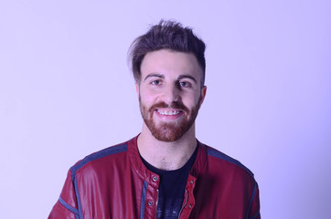 Portrait of young man with brackets on isolated white background