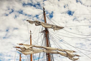 mast of old sailing ship on the sky background