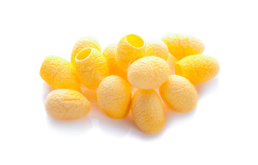 yellow thai silkworm cocoons pile isolated on white background