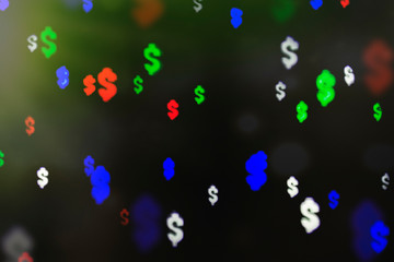 Bokeh in the form of a dollar sign. The concept of wealth and money, trading on the stock exchange and economic growth, rich