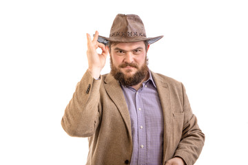 Portrait modern day american big attractive bearded cowboy on white