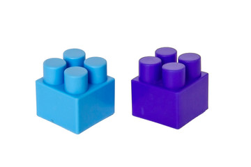 Obraz premium details of a children's plastic constructor on a white background. colored cubes. block.