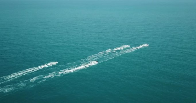 Hydrocycles Rides Away in Blue Sea. Panoramic Viewing from Drone